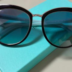 Tiffany & Co. TF4146 sunglasses featuring black frames and soft gradient lenses