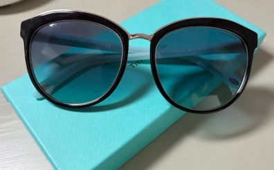 Tiffany & Co. TF4146 sunglasses featuring black frames and soft gradient lenses