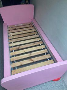 Two pink Ikea beds
