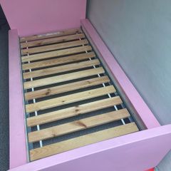 Two pink Ikea beds