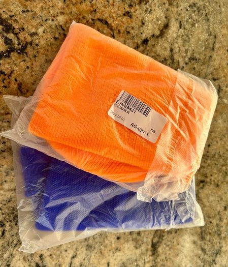 Pair of orange and blue hats