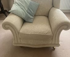 Cream armchair on brass caster