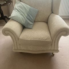 Cream armchair on brass caster