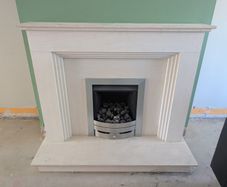 Portuguese limestone fireplace and gas fire
