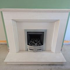 Portuguese limestone fireplace and gas fire