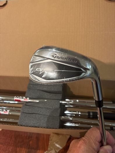 Taylormade Qi Irons 5 to SW regular flex still in the box 9 iron and 5 iron hit once wrappers still on irons