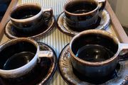 Vintage American studio pottery cups and saucers.