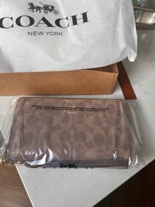Brand New Coach zip around wallet in signature print