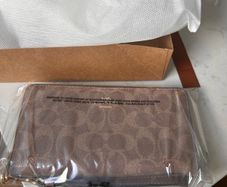 Brand New Coach zip around wallet in signature print