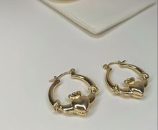 Gold tone claddagh earrings