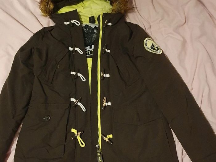 Superdry women's dark green (khaki) winter parka with a fur hood and toggle fastening