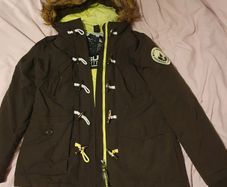 Superdry women's dark green (khaki) winter parka with a fur hood and toggle fastening