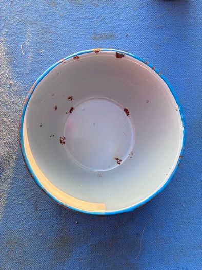 Vintage grey enamel dish with blue rim