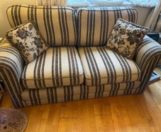 Beige and brown Couch with 2 cushions