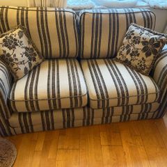 Beige and brown Couch with 2 cushions