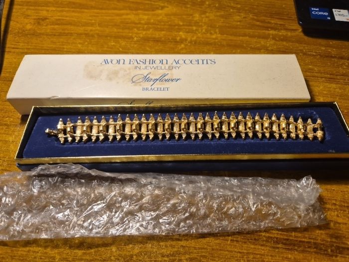 Rare Find. 1960s Avon Starflower gold plated bracelet in original box.