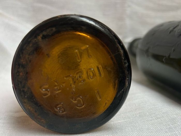 Antique Cork Advertising Bottles x2