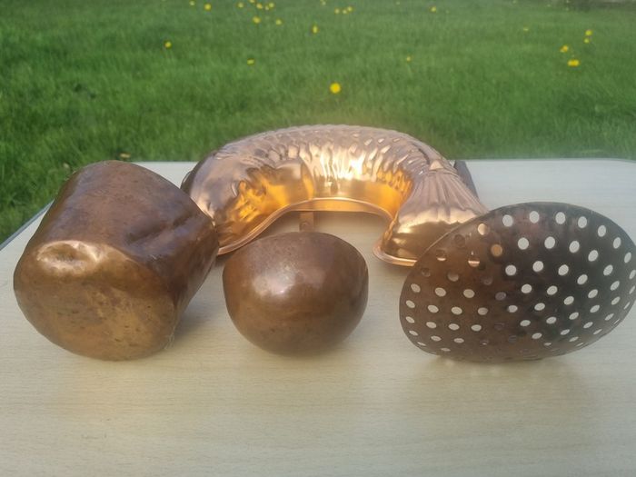 Vintage-style copper cookware and kitchen accessories.
