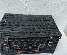 Black wicker picnic basket with leather straps