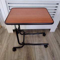 Adjustable over bed table on wheels