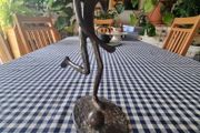 Vintage brass figurine of a football player