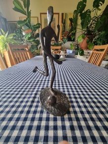 Vintage brass figurine of a football player