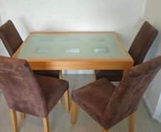 Extendable wooden table with cristal surface