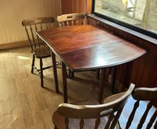 Wooden dining table and six chairs