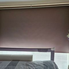 Beige Blackout roller blind with a white control chain