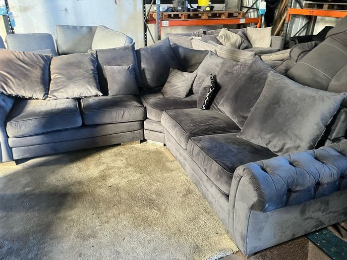 Grey corner sofa with scatter cushions