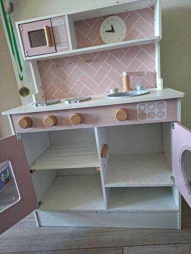 Wooden kitchen with kitchen toys