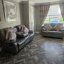 Grey leather recliner sofa set with pink curtains Image 2