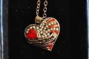 Heart-Shaped Pendant Necklace with Red Glass Heart and Wing Details