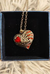 Heart-Shaped Pendant Necklace with Red Glass Heart and Wing Details