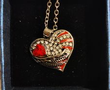 Heart-Shaped Pendant Necklace with Red Glass Heart and Wing Details