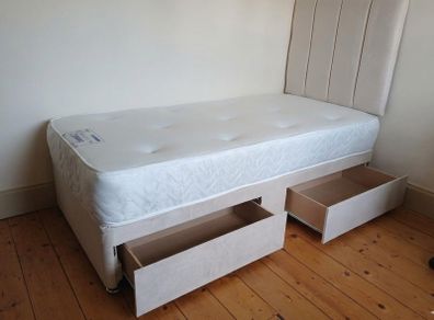 Single beds, cream, pink and navy blue