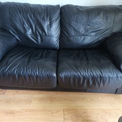Black leather two-seater sofa-bed