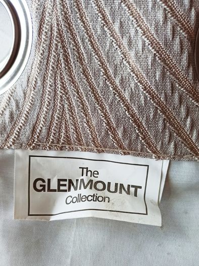 Textured light brown swirl patterned eyelet curtains from The Glenmount Collection made of polyester  size h 230cm, w 220cm (each)