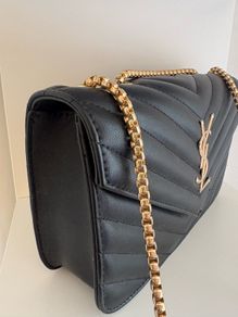 ladies black padded bag with gold coloured hardware. Brand new