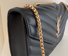 ladies black padded bag with gold coloured hardware. Brand new