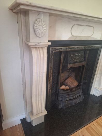 Castiron fireplace and surround plus marble mantlepiece and black stone heart