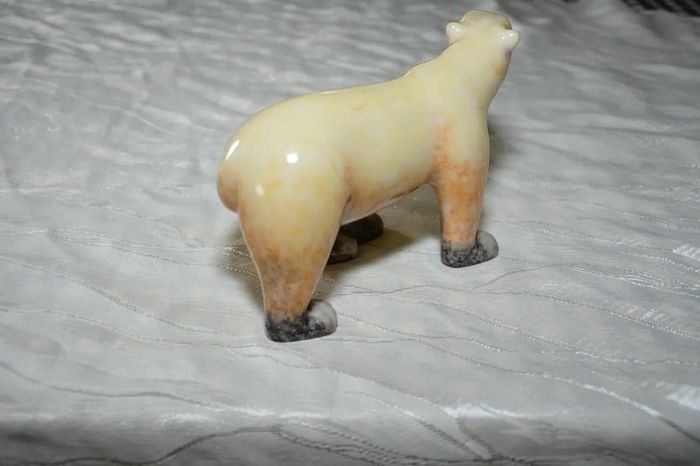 Stone sculpture of a white polar bear