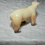 Stone sculpture of a white polar bear Image 3