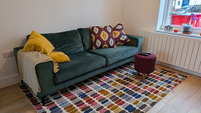 Three seater green velvet couch