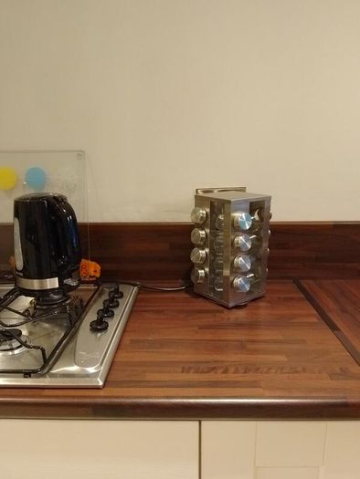 Rotating spice rack with 16 glass jars