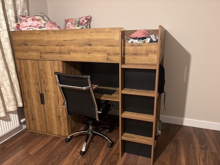 bunk bed with table and wardrobe