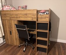 bunk bed with table and wardrobe