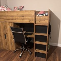 bunk bed with table and wardrobe