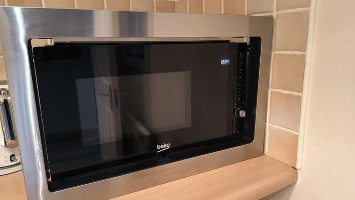 For sale: Beko MGB25332BG built-in microwave with grill, stainless steel finish.