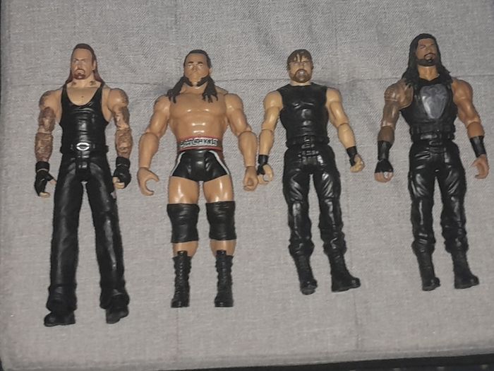 WWE Action Figures: Undertaker, Roman Reigns, Rusev, Dean Ambrose